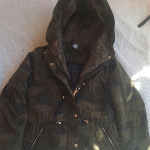Winter coat for a child by divided. Camo print.